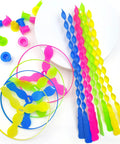 Colorful 40 Pack Flying Disc Toys Twisty Helicopter Spin Copter Propeller Flyers Saucers With Launchers on white surface