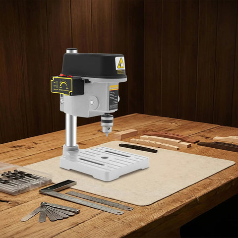 Compact 340W Mini Benchtop Drill Press on a wooden table, featuring a pure copper motor for precision DIY crafts.