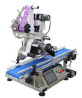 Industrial Grade Automatic Flat Surface Label Applicator With Touchscreen Control And Auto Photo Sensor view from left, showing blue conveyor and control panel.