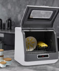 Compact Portable Countertop Dishwasher Featuring Three Wash Cycles And A Straight Up No Install Faucet Setup with open lid displaying dishes.