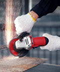 Premium Heavy Duty 4 1/2 Inch Angle Grinder With A Badass 7.5 Amp Motor cutting metal with sparks flying.