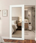 36 By 80 Inch Sliding Barn Door Featuring Concealed Hardware And Butter Smooth Soft Close System Plus Full Length Mirror in stylish room.