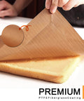 Must Have Nonstick Teflon Sheets 12 By 16 Inches with heat resistant fiberglass coating being lifted from a cake surface