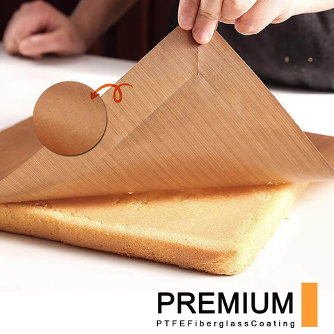 Must Have Nonstick Teflon Sheets 12 By 16 Inches with heat resistant fiberglass coating being lifted from a cake surface