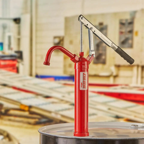 Top Shelf Heavy Duty Lever Drum Pump For Smooth Oil And Fuel Transfer with red frame on 55-gallon drum in background.