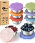 Eight Pack 1.6 Oz Portable Salad Dressing Containers With Lids, Leakproof Stainless Steel Sauce Cups, shown with berries and sauce