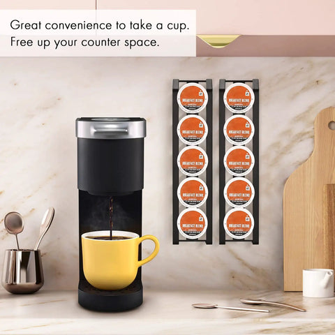 Side Mount K Cup Holder For Keurig Adhesive Metal Pod Organizer Matte Black Finish 2 Pack Keeps 10 K Cups Handy And Neat Space Saving Counter Mount For Keurig Coffee Makers. Displayed on a kitchen wall.