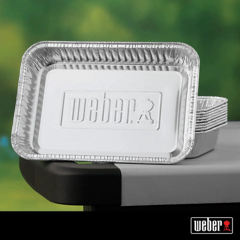 Aluminum Drip Pans 10 Pack For Gas Grills Indirect Grilling And Grease Catching Ideal For Roasts Turkeys And Gravy Drippings Easy Cleanup Disposable Foil Pans For Grill Trays stacked on a grill side shelf