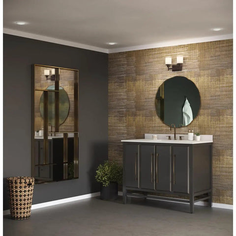 Two Light Bath Vanity Light In Antique Bronze With Etched Umber Linen Glass And Clear Edge Glass in a modern bathroom setting