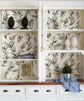 White cabinet interior lined with Dope Green Leaf Peel And Stick Wallpaper Self Adhesive Olive Leaf Sage Eucalyptus Farmhouse Vinyl Roll.
