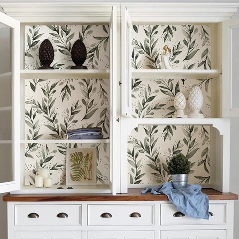 White cabinet interior lined with Dope Green Leaf Peel And Stick Wallpaper Self Adhesive Olive Leaf Sage Eucalyptus Farmhouse Vinyl Roll.