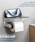 Brushed Nickel Toilet Paper Holder With Large Phone Shelf, 304 Stainless Steel Wall Mounted Bathroom Paper Roll Dispenser, Open Arm Toilet Tissue Holder, No Wobble Design For Phones And Small Items displayed holding a smartphone and toilet paper roll against a bathroom wall.