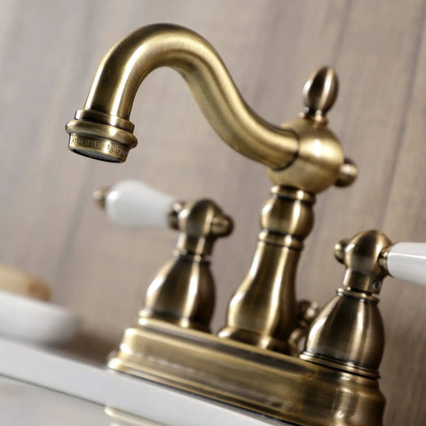Antique Brass 4-Inch Centerset Bathroom Faucet Deck Mount 3-Hole Setup with Drip-Free Washerless Cartridge, close-up view