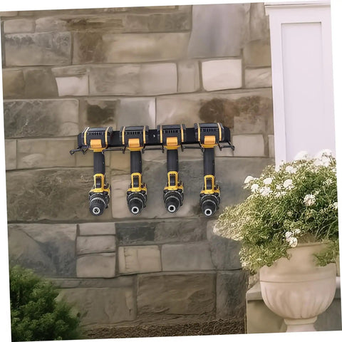 Heavy Duty Wall Mounted Power Tool Holder With Rock Solid Steel Garage Storage Rack For Drills And Hand Tools, holding four drills on a stone wall.