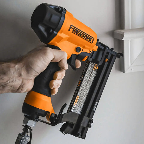 Hand holding G2XL31 Second Gen Pneumatic 3 in 1 Finish Nailer And Stapler for 16 and 18 gauge with adjustable belt hook