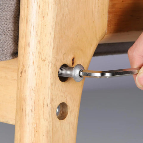 Built Like A Tank M6 X 12Mm Button Head Socket Cap Screws 100 Pack being tightened on wooden furniture with an Allen wrench.
