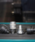 Heavy-Duty Three Eighths Inch Hydraulic Quick Connect Coupler Set For Ten Thousand PSI Systems, Three Eighths Inch NPT Thread, Screw-To-Connect, Steel With Zinc-Plated Finish For Corrosion Resistance And Secure Engagement On Pumps And Cylinders, shown with dust caps