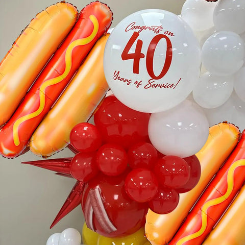 Giant Hot Dog Balloons Set Of 6 28 Inch Food Shape Party Decor For BBQ Picnic Birthday Summer Fun Not Float With Helium Durable Foil Balloons Great For Catering Events And Themed Parties displayed with red and white balloons celebrating 40 years.