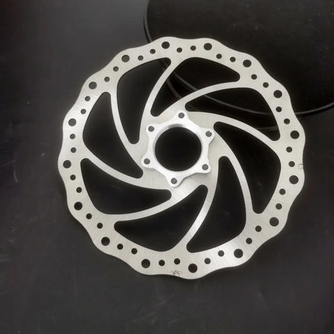 180mm Bicycle Disc Brake Rotor With Flange Adapter For Threaded Hubs Stainless Steel 2mm Thick Silver Finish on dark surface