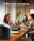 Nugget ice maker, black countertop appliance on wooden table, front-left view.