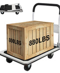 Heavy Duty Foldable Platform Truck With 880 Lb Capacity carrying a large wooden crate, industrial use utility cart with strong frame and wheels.