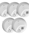 Interconnect Hardwired Smoke And Carbon Monoxide Alarm With Battery Backup Five Pack For Home Safety And No More False Alarms With Precision Detection And Dual Sensor Protection. Five white circular alarms with test button and grill, front view.