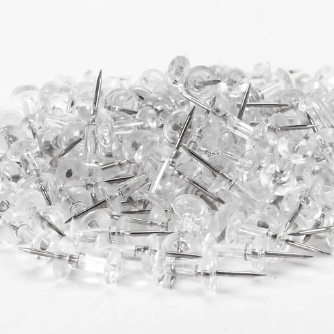 Legit Durable Push Pins 600 Count Standard Thumb Tacks With Kickass Steel Points And Clear Rounded Tops in a pile.