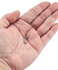 Hand holding miniature screws from Hex Bolts And Miniature Self-Tapping Screws Set, 600/1200 Piece Kit With Crosshead Screws
