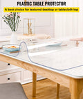 Clear 24 By 60 Inch Table Protector 1.5mm Thick PVC Desk Mat on wooden table in dining room, showing protective and clear cover.