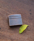 New Dope Habaki Collar Alloy Or Copper 01 22 Fit Katana Wakizashi Tanto on wooden surface with leaf
