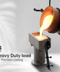 Metal casting process with molten metal pouring into a mold, heavy duty load indication, precision casting equipment shown.