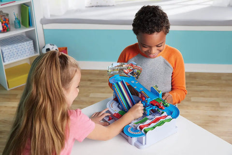 Children playing with Mario Kart Racing Deluxe Obstacle Course Set With Dual Lane Track And Lap Counter Includes Mario And Luigi Kart Figures Easy Assembly Six Obstacle Challenges Multiplayer Ready For Ages Five And Up Perfect Family Party Game Gift