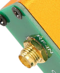 Pro 0.1 Mhz To 6 Ghz Full Band Low Noise Amplifier RF-In connector close-up on green module with gold SMA jack.