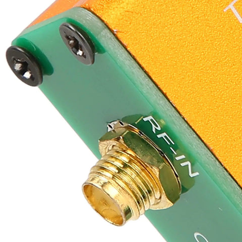 Pro 0.1 Mhz To 6 Ghz Full Band Low Noise Amplifier RF-In connector close-up on green module with gold SMA jack.