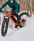 Cyclist riding with grippy fat tire front and rear wheel set for snow beach and e bike 20 24 26 inch disc brake wheelset