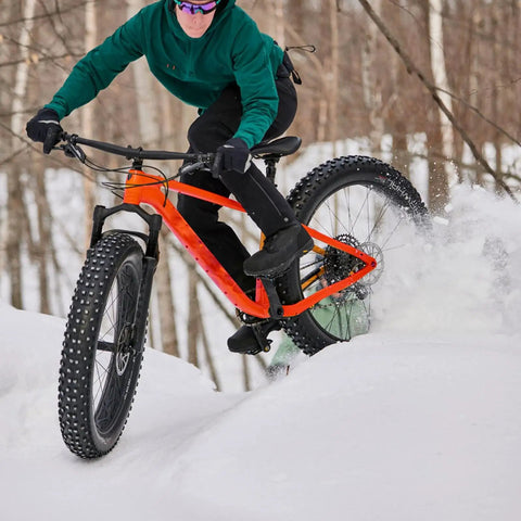 Rider on snow with Fat Tire Front And Rear Wheelset For 20 24 26 Inch Bikes 4 Inch Wide Bead Grippy Beefy Snow Beach E Bike