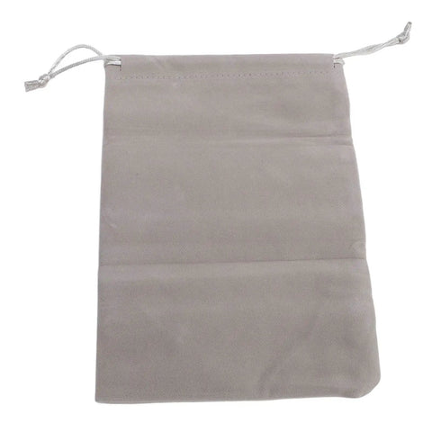 Grey velvet drawstring pouch for storage, smooth finish, ideal for jewelry or small items.