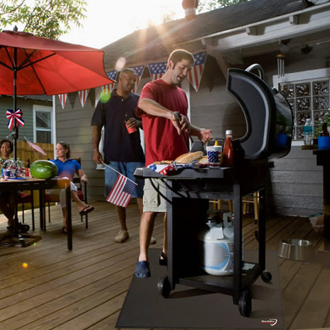 Man grilling on a deck with 40 Inch Square Fire Pit Mat For Decks, Patios And Grills, Fireproof And Waterproof Under Grill Pad