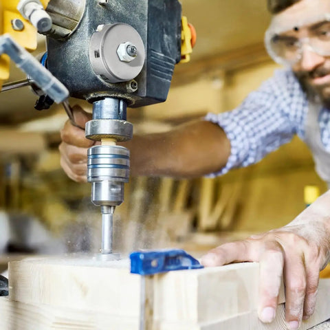 Drill Press Return Spring Set For Quill Coil Assembly, shown in use on bench drill, cutting through wood in workshop.