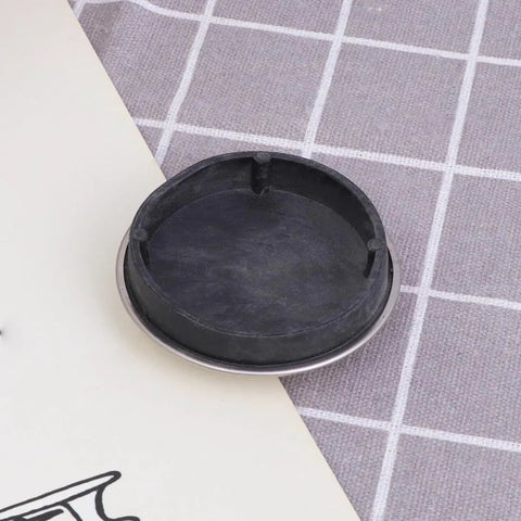 2pcs Rubber Bathtub Drain Stopper for Kitchen and Laundry Use, showing black rubber stopper with metallic rim on a textured surface.