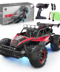 Beast Mode One Sixteen Scale Off Road RC Monster Truck With Twenty Kmph Top Speed LED Headlights And Chassis Lights shown with remote.