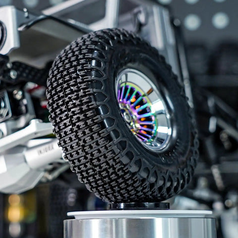 XHX Pin Tires For 1.3 Inch Wheels Fit TRX4M And SCX24 Rock Crawlers, 72x24 Mm, S5 Compound Delivering Mad Traction On Rugged Terrain, Precise Handling, And All Terrain Confidence For Off Road Adventures mounted on a wheel with detail view