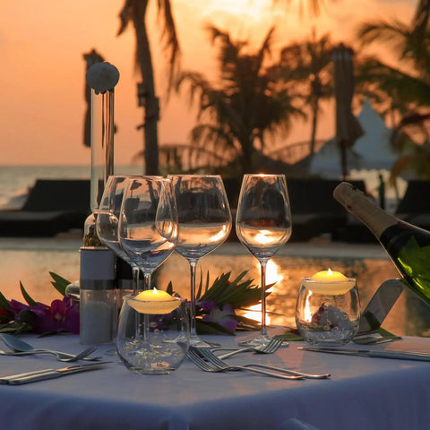 Evening table setting with 48 Pack Floating LED Candles Water Activated Battery Powered Flameless Flicker Lights at sunset