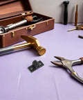 Heavy Duty Aluminum Corner Bracket Set for Extrusion Frames amidst various tools on a purple surface