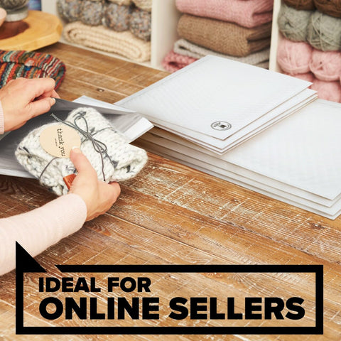 Person placing knitted item into Large White Poly Bubble Mailer Size 5 10.5 X 15 In Inside Dimensions With Cushioned Bubble Liner