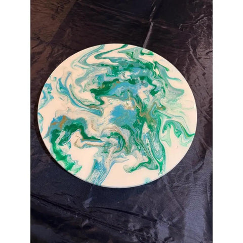 Hand Painted 18 Inch Lazy Susan With Clear Resin Coat, Durable Wood Design featuring green and blue swirls on dark cloth background.