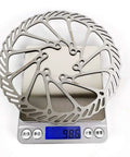 Beefy G3 Stainless Steel Disc Brake Rotors 160mm 180mm 203mm 2 Pack with Bolts displayed on digital scale