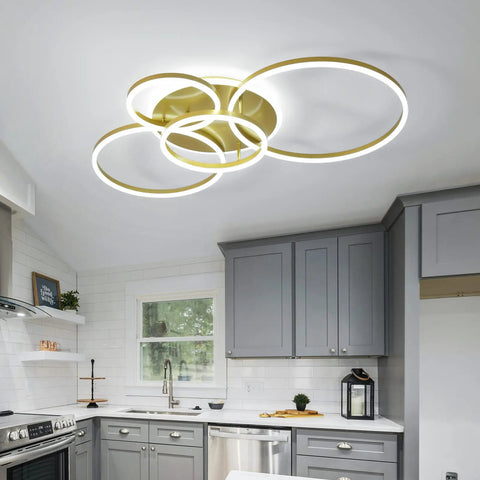90W Dimmable LED Ceiling Light With Remote Control, 5 Ring Flush Mount Gold Acrylic Chandelier illuminating a modern kitchen