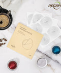 Aluminum Foil Lids For Reusable Nespresso VertuoLine Pods 62mm 200 Pack Budget Friendly Durable Seals For Fresh Flavor Easy To Use Fits VertuoLine Reusable Pods Coffee Pods Not Included with coffee and pods on marble surface.