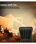 JUDYSSY New Led Floodlight Three-Color Light Adjustable Brightness Spotlight showing adjustable design at a campsite.